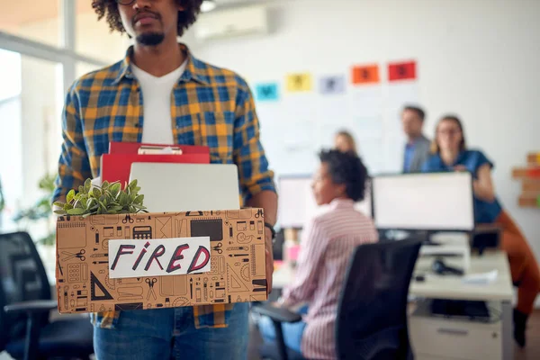 Young Sad Clerk Carries His Belongings Leaves Office Being Fired — Stock Photo, Image