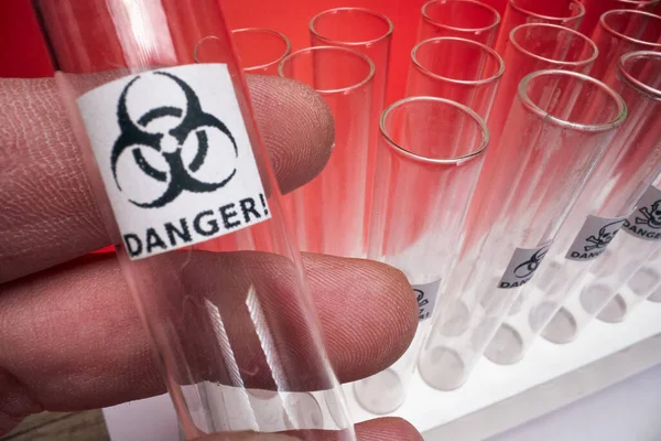 stock image Macro view of a test tube in the hand in the sterile environment in the lab. Laboratory, test, apparatus