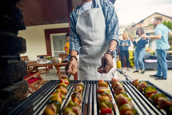 Close View Sizzling Grill Foreground Hands Expertly Maneuver Skewers Loaded — Stock Photo, Image