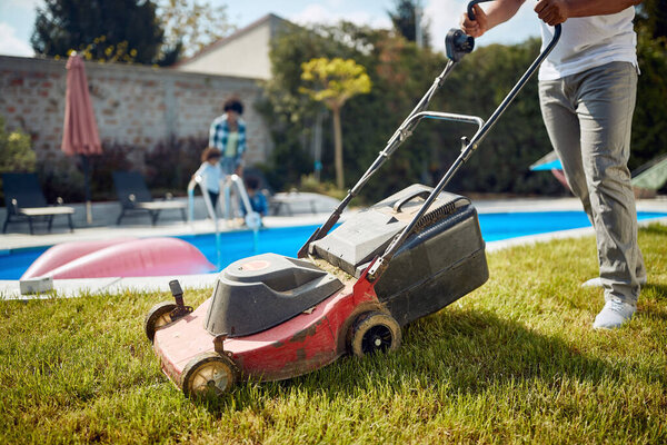 Low Section Shot Young Man Mowing Grass Pool Clean Cut Stock Picture
