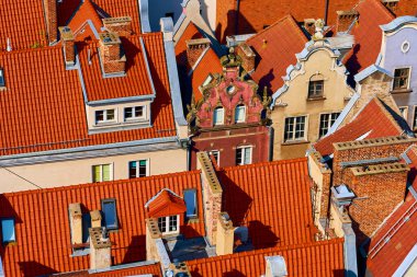 Tile roofs in popular European city, top view. Beautiful ancient architecture clipart