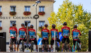  Chartres, France - October 08, 2023: Backstage image of the Team Lotto Dstny on the stage during the teams presentation before the Paris-Tours 2023 road cycling race.  clipart