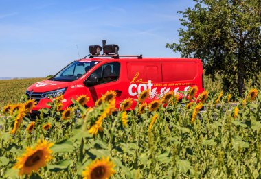 Villefranche-d'Albigeois, France - July 17th, 2022: The vehicle of CGT passes near a field of sunflowers during the stage 15 of Le Tour de France 2022. CGT (The General Confederation of Labour) is an important French national trade union center clipart