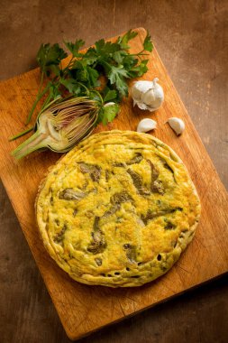 wole omelet with artichoke with parsley and garlic