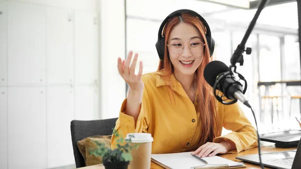 Cheerful Woman Hosting Live Podcast Engaging Audience Using Professional Microphone — Stock Photo, Image