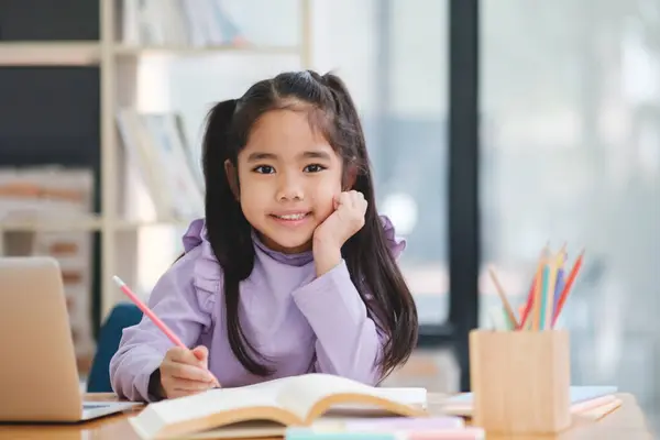 Young Girl Sitting Desk Laptop Book She Smiling She Enjoying — Stock Photo, Image