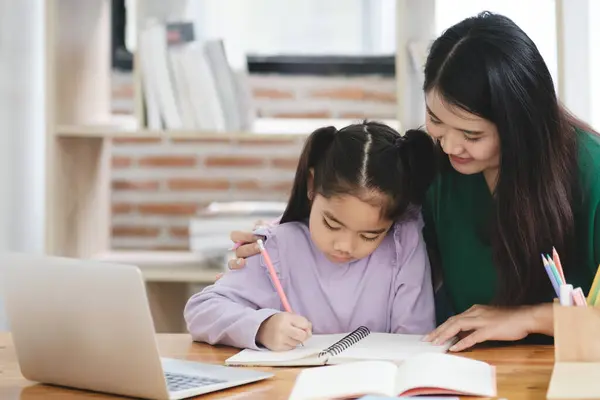 Woman Helping Young Girl Her Homework Girl Wearing Purple Shirt — Stock Photo, Image