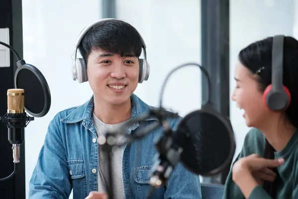 Two People Sitting Studio Microphones Headphones One Them Smiling Other — Stock Photo, Image