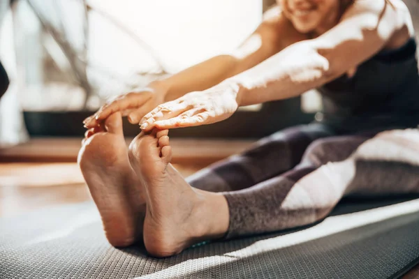 Cropped Shot Relaxed Young Woman Doing Stretching Yoga Exercises Home — Foto Stock