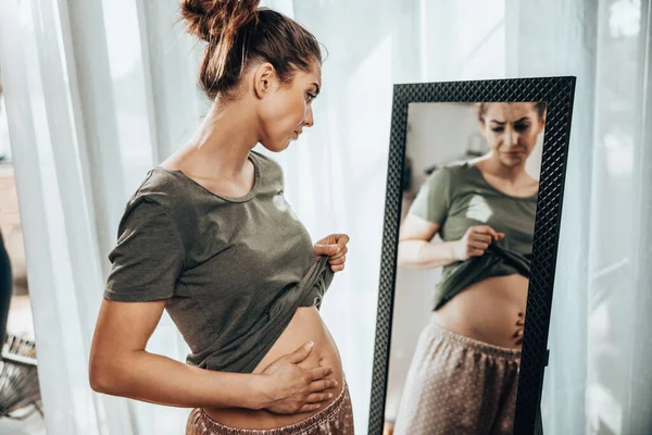Unhappy Woman Standing Front Mirror Holding Her Stomach While Suffering — Foto de Stock