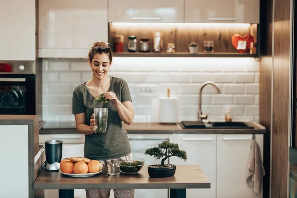 Young Smiling Woman Putting Variety Vegetables Blender Making Healthy Smoothie — Stockfoto
