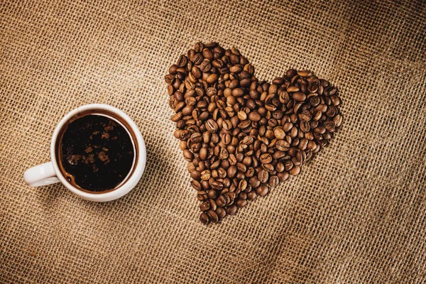 Fresh Roasted Coffee Beans Form Heart Burlap Bag Hot Cup — Stock Photo, Image
