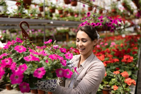 Smiling Young Woman Working Flower Garden Holding Flower Pots Enjoying - Stock-foto