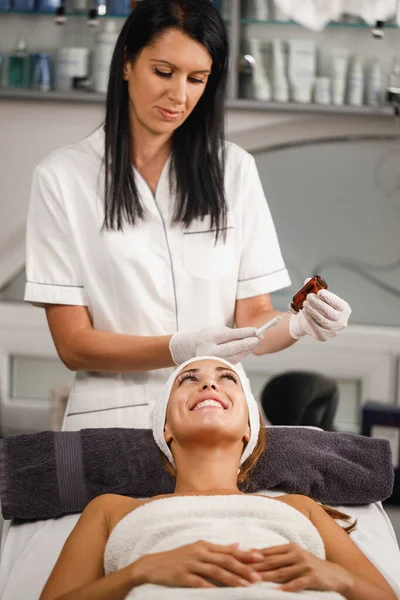 Shot of a beautiful young woman on a facial micro-needling treatment at the beauty salon.