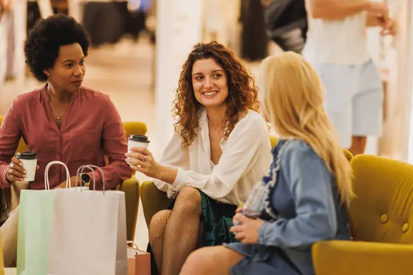 Happy Female Friends Taking Coffee Break Smiling While Doing Shopping — Stock Photo, Image