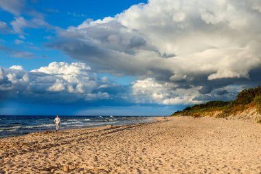 A walk on the beach on a cloudy day