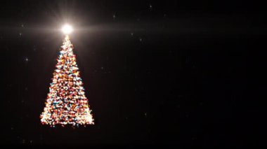 Mutlu Noeller video kartı. Parlayan ışıkları ve parlayan yıldızları olan Noel ağacı, 4K tatil arka planı animasyonu