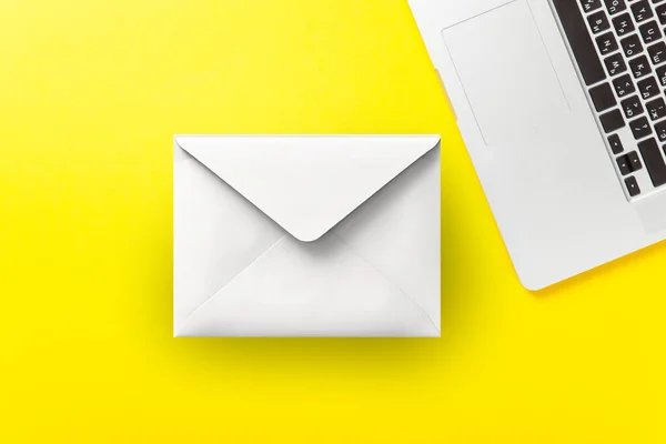 One Laptop Computer Abstract Envelope Yellow Background Overhead View Royalty Free Stock Images