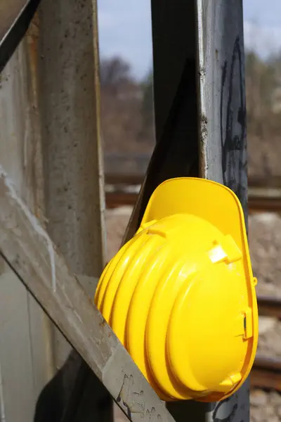 safety first yellow helmet at the work place