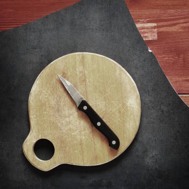 a little kitchen knife on wooden table clipart