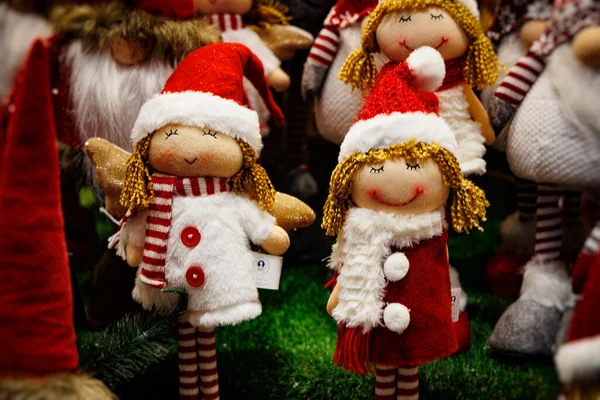 stock image beautiful plush christmas elves in red hats background