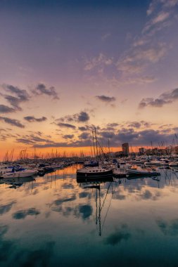 beautiful sunset in the port of Alicante, Spain with yachts