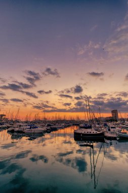 beautiful sunset in the port of Alicante, Spain with yachts