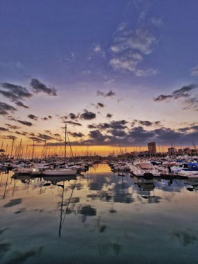 beautiful sunset in the port of Alicante, Spain with yachts
