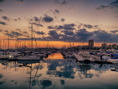 beautiful sunset in the port of Alicante, Spain with yachts