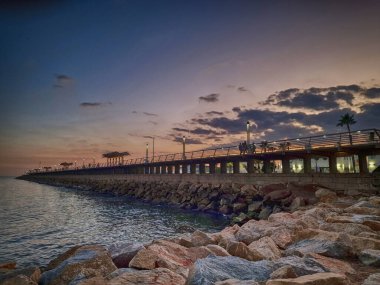 beautiful sunset landscape of alicante spain with pier