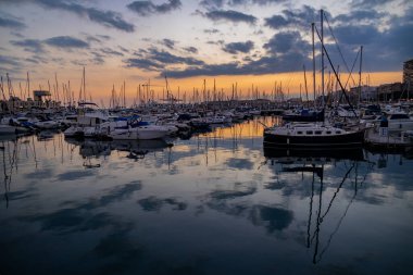 beautiful sunset in the port of Alicante, Spain with yachts