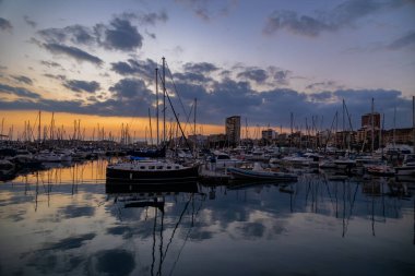 beautiful sunset in the port of Alicante, Spain with yachts