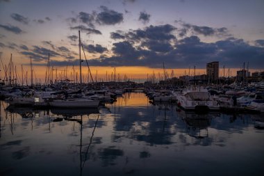 beautiful sunset in the port of Alicante, Spain with yachts