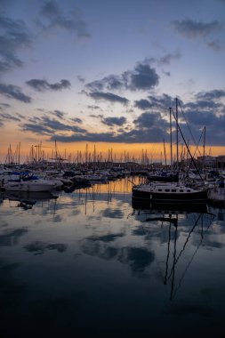 beautiful sunset in the port of Alicante, Spain with yachts