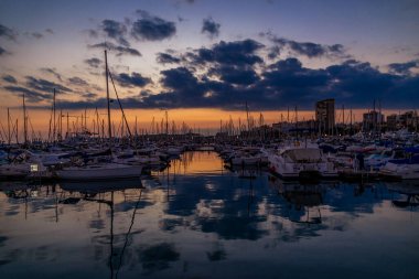 beautiful sunset in the port of Alicante, Spain with yachts
