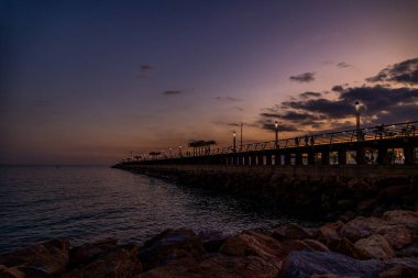 beautiful sunset landscape of alicante spain with pier
