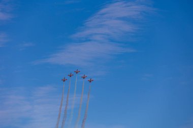 beautiful flight of five cessna planes over alicante smoke spanish flag against the blue sky spain