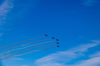beautiful flight of five cessna planes over alicante smoke spanish flag against the blue sky spain