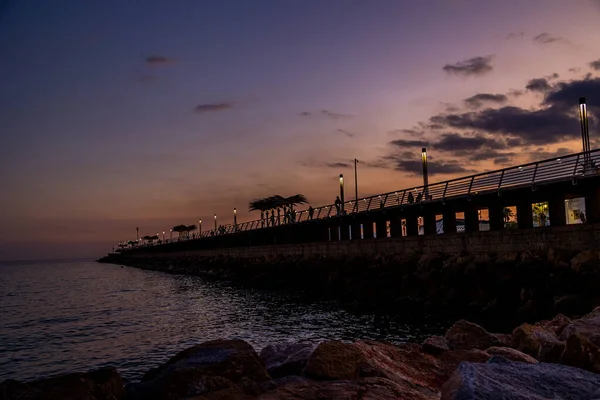 beautiful sunset landscape of alicante spain with pier