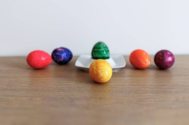 large colorful easter eggs on a stand decoration card