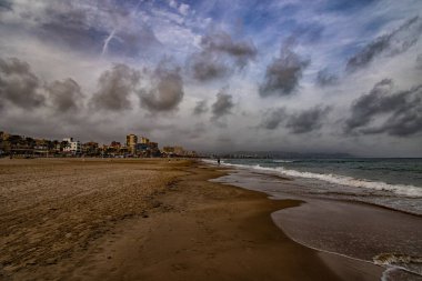 beautiful landscape wide sandy beach in alicante autumn day clouds