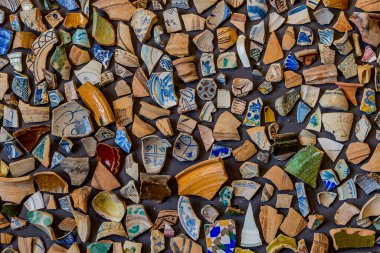 beautiful background from pieces of clay colored broken pottery decoration abstract