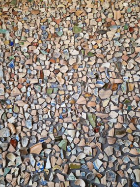 beautiful background from pieces of clay colored broken pottery decoration abstract