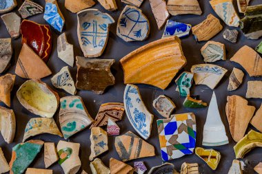 beautiful background from pieces of clay colored broken pottery decoration abstract