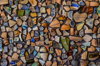 beautiful background from pieces of clay colored broken pottery decoration abstract