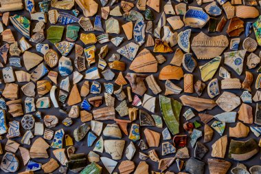 beautiful background from pieces of clay colored broken pottery decoration abstract