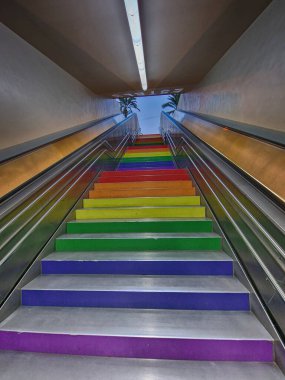 beautiful concrete stairs up painted in rainbow colors urban architecture Alicante Spain