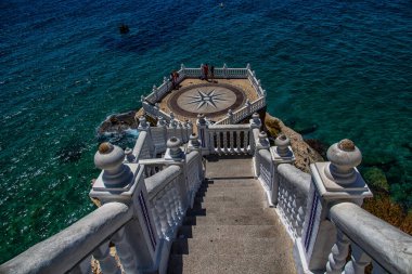 beautiful white viewpoint in the old town of Benidorm Spain against the blue sea on a summer day