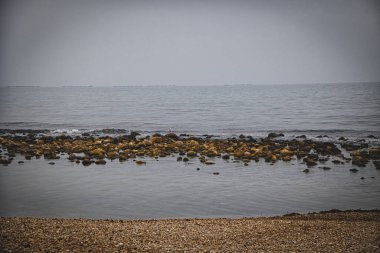 beautiful landscape empty rocky beach on a cloudy day spain
