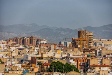 beautiful view on a sunny day of the city and colorful buildings from the viewpoint Alicante Spain